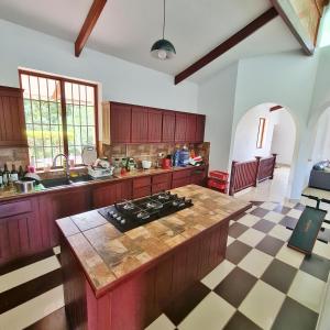 a kitchen with a stove and a counter top at Hacienda Tarapoto Selva Alta Ecolodge in Tarapoto