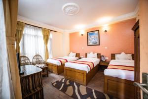 Voodi või voodid majutusasutuse Kathmandu Garden Home toas