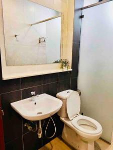 a bathroom with a toilet and a sink at Stunning View Boho Nova 3BR@KEA FARM, Brinchang, Cameron Highlands in Brinchang