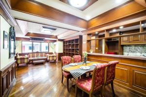 a dining room with a table and chairs at ZJ HOUSE in Patong Beach