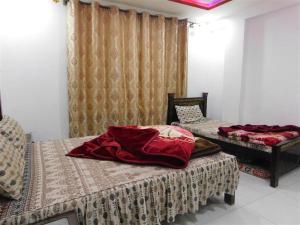 Posteľ alebo postele v izbe v ubytovaní New Balakot Hotel