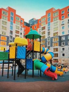 a playground with a slide at ABYROY-RESIDENCE in Atyrau
