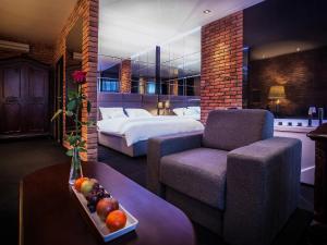 Posteľ alebo postele v izbe v ubytovaní Hotel Betmanowska Main Square Residence Adults Only