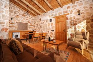 a living room with a couch and a table at Sedir Taş Evleri in Kalkan