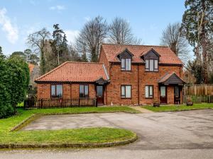 a large brick house with a driveway in front of it at Woodpecker - 19265 in Horsford