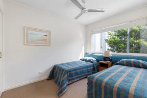Ένα ή περισσότερα κρεβάτια σε δωμάτιο στο Unit 7 Coolum Blueseas +5 φωτογραφίες
