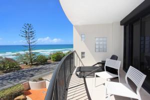 a balcony with chairs and a view of the ocean at Unit 4 The Rocks in Coolum Beach