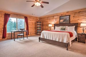 a bedroom with a bed and a desk and a window at Brookings Vacation Rental Lodge on 88 Acres! in Brookings
