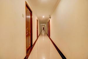 an empty hallway with a long corridor at FabHotel Royal Park Residency in Chennai