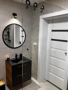 Kúpeľňa v ubytovaní Apartamenty Czarna Perła