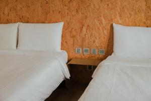 Una cama o camas en una habitación de Light Hostel - Tainan