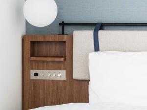 En eller flere senge i et værelse på Comfort Hotel Yokkaichi