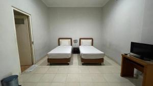 Voodi või voodid majutusasutuse Planters Guest House toas