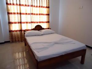 Letto o letti in una camera di Hotel Glee
