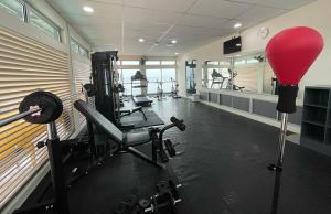 a gym with tread machines and a red ball at The Elopura Hotel in Sandakan