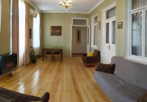 a living room with a couch and a table at Apartment Sunrise in Sighnaghi