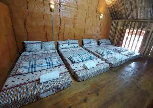 Giường trong phòng chung tại Quanba Taigoo - HomeStay