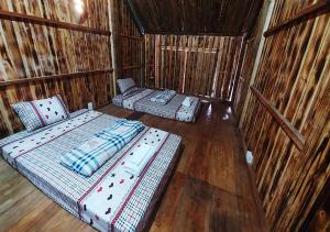 Ліжко або ліжка в номері Quanba Taigoo - HomeStay