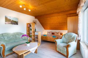 Area soggiorno di Pension Am Weinberg Sächsische Schweiz