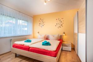 Letto o letti in una camera di Pension Am Weinberg Sächsische Schweiz
