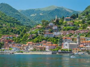a town on the shore of a body of water at Casa Hygge Argegno – Lake Como in Argegno