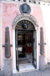an entrance to a store with a glass door at Hotel San Fantin in Venice