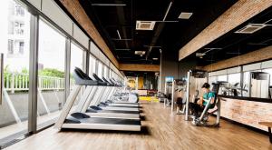 a gym with a row of treadmills at Orchard Garden -Near TSN Airport 5 minutes -Nice in Ho Chi Minh City
