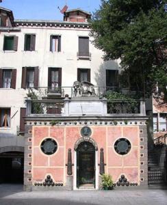 a building with a door in front of it at Hotel San Fantin in Venice