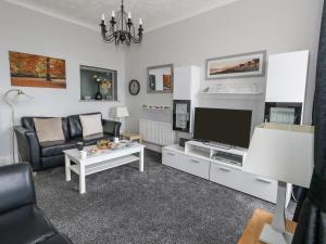 TV a/nebo společenská místnost v ubytování Sunbeach