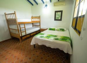 Ένα ή περισσότερα κρεβάτια σε δωμάτιο στο Hotel Barranqueros Soledén