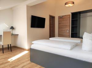 Postel nebo postele na pokoji v ubytování Hotel Am Gleis 1