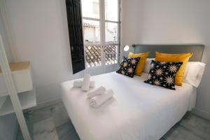 Granadi Apartamentos客房内的一张或多张床位