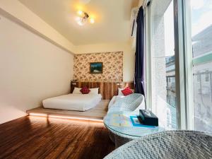 Katil atau katil-katil dalam bilik di Sweet B&B 幸福微甜民宿