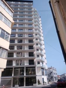 a tall white building with many windows at CP High floor luxury studio with sea view in Gibraltar