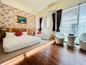 Postel nebo postele na pokoji v ubytování Sweet B&B 幸福微甜民宿