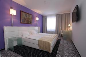Postel nebo postele na pokoji v ubytování Hotel Phoenix