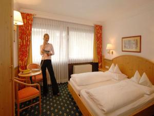 A bed or beds in a room at Vital - und Wellnesshotel Hanneshof