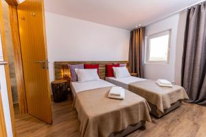 Postel nebo postele na pokoji v ubytování Olá Vida - Hostel Caminha