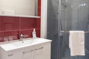 a bathroom with a shower and a sink at Villa Rosa in Makarska