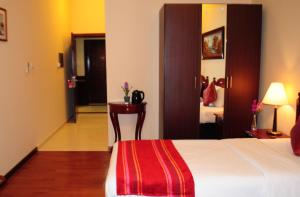 מיטה או מיטות בחדר ב-Fortune Deira Hotel