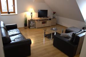TV in/ali zabaviščno središče v nastanitvi Apartmany U Lva