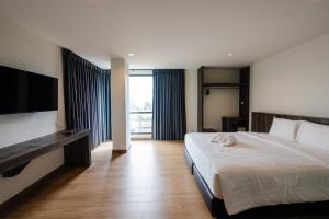 Postel nebo postele na pokoji v ubytování JS HOTEL