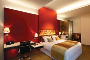 D'Hotel Singapore managed by The Ascott Limited客房内的一张或多张床位