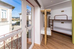 Postel nebo postele na pokoji v ubytování Olá Vida - Hostel Caminha