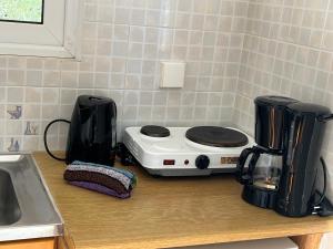 a toaster sitting on a counter in a kitchen at Alexandra’s Studios Sunset View in Argostoli