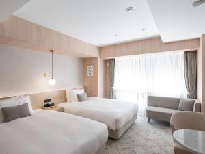Postel nebo postele na pokoji v ubytování HOTEL THE LEBEN OSAKA + 37 fotografií