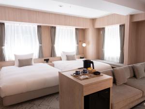 Postel nebo postele na pokoji v ubytování HOTEL THE LEBEN OSAKA