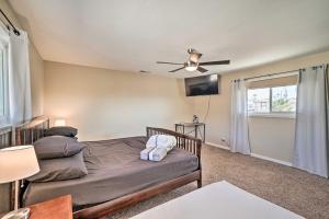 two beds in a room with a ceiling fan at Family Friendly Vacation Rental with Gas Grill! in Lake Havasu City