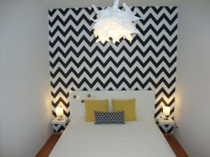 A bed or beds in a room at Viktória Beach Apartman Gold 1. Siófok
