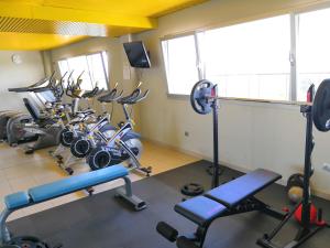 a gym with a row of exercise bikes in it at Sercotel Jardines de Uleta Suites in Vitoria-Gasteiz